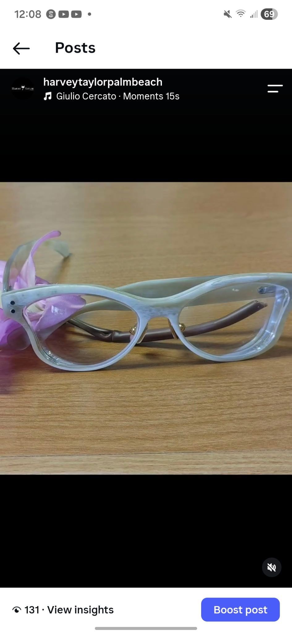 Translucent Harvey Taylor eyewear photographed on a wooden table